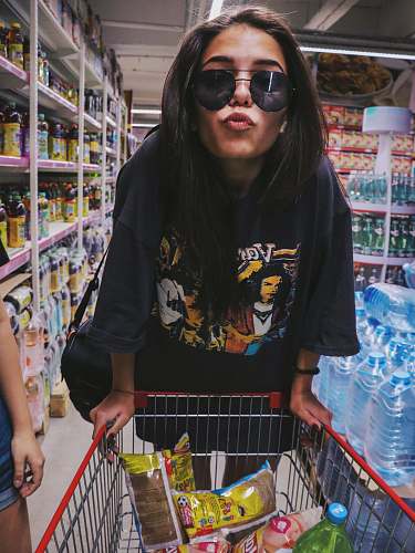 grocery store woman in black T-shirt pouting lipes supermarket